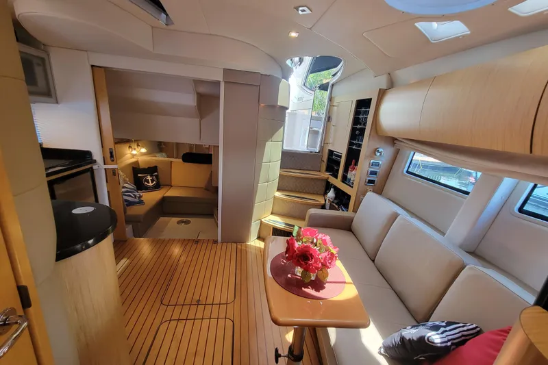 Slide: The Image of Luxurious 2012 Four Winns V435 yacht interior with elegant seating and modern amenities. - 60