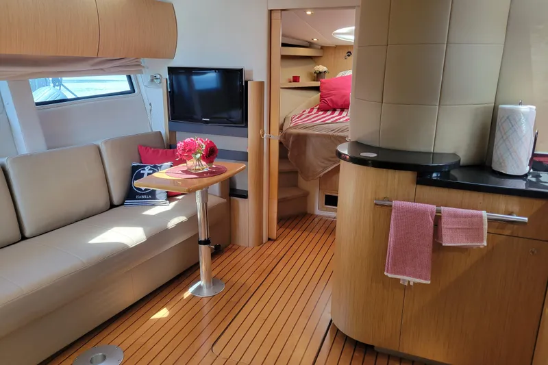 Slide: The Image of Luxurious 2012 Four Winns V435 yacht interior with modern furnishings and cozy cabin. - 62