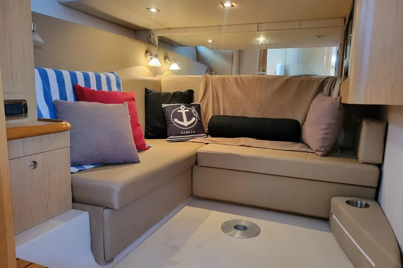 Slide: The Image of Interior of 2012 Four Winns V435 yacht with cozy seating and decorative pillows. - 66