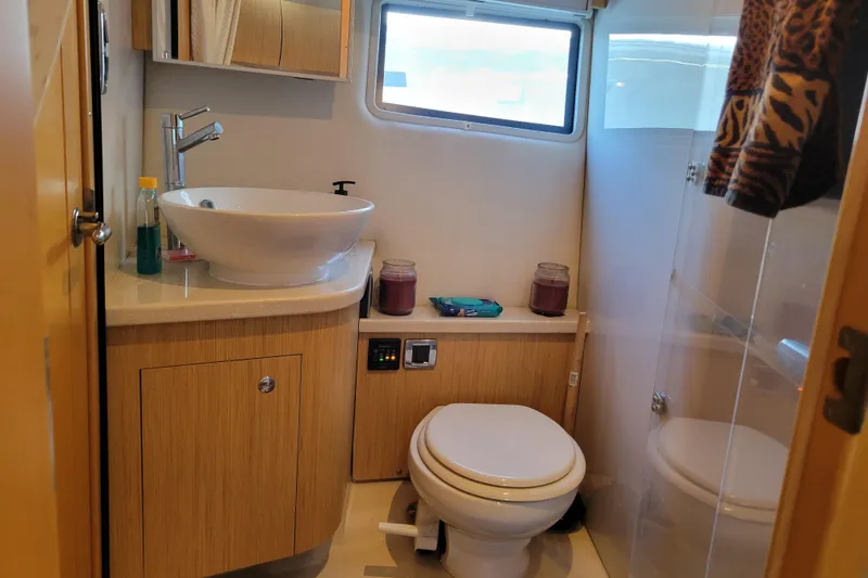 Slide: The Image of Luxurious bathroom in 2012 Four Winns V435 yacht with modern fixtures and elegant design. - 69
