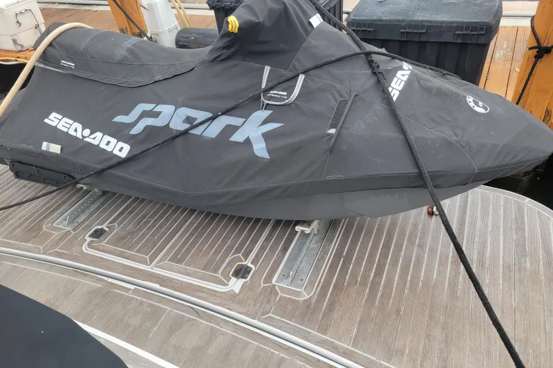 Slide: The Image of 2012 Four Winns V435 with covered Sea-Doo Spark on deck. - 75