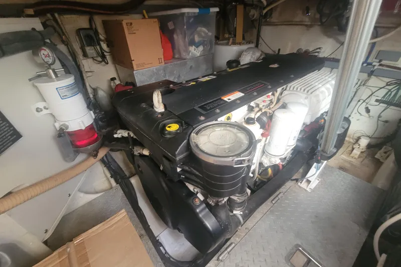 Slide: The Image of Engine room of a 2012 Four Winns V435 boat, showcasing mechanical components. - 84