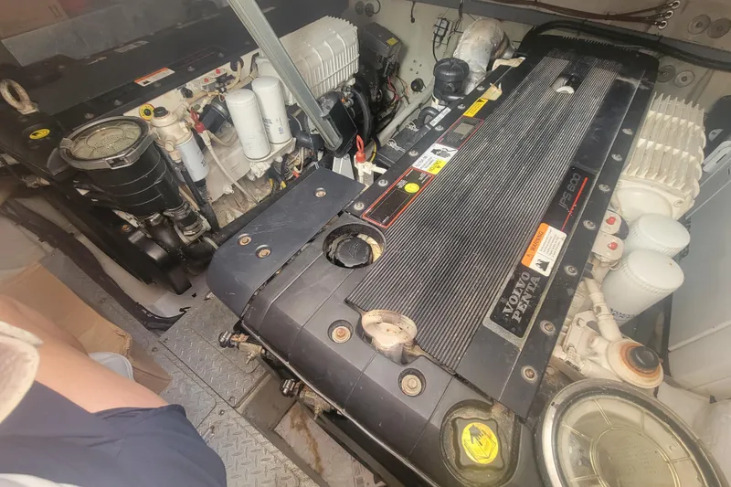 Slide: The Image of Engine compartment of a 2012 Four Winns V435 boat, featuring a Volvo Penta IPS600 engine. - 85