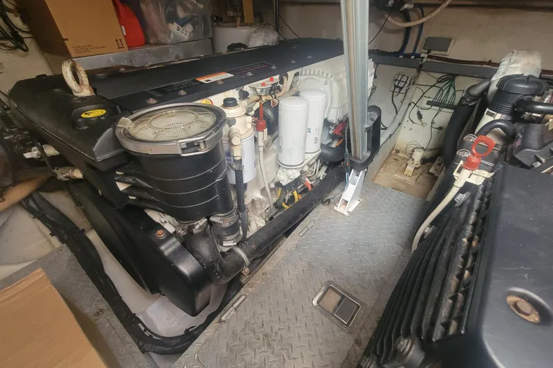 Slide: The Image of Engine room of a 2012 Four Winns V435 boat, showcasing mechanical components. - 86