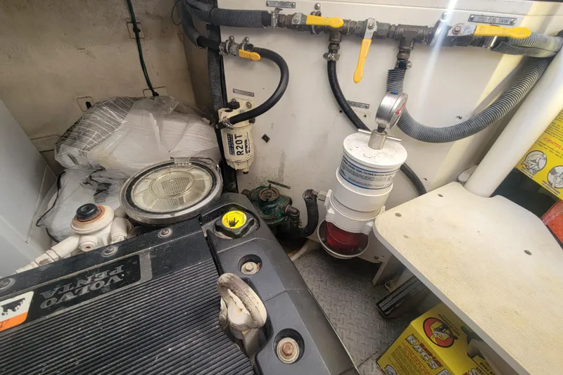 Slide: The Image of Engine room of 2012 Four Winns V435 boat with Volvo Penta components and fuel filter system. - 87