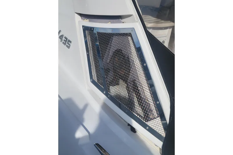 Slide: The Image of 2012 Four Winns V435 boat with mesh-covered window detail. - 88