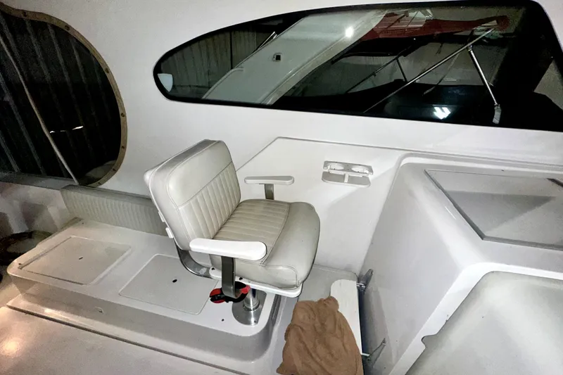 Slide: The Image of Captain's chair on 2003 Mainship Pilot 30-II boat, featuring sleek interior design. - 5
