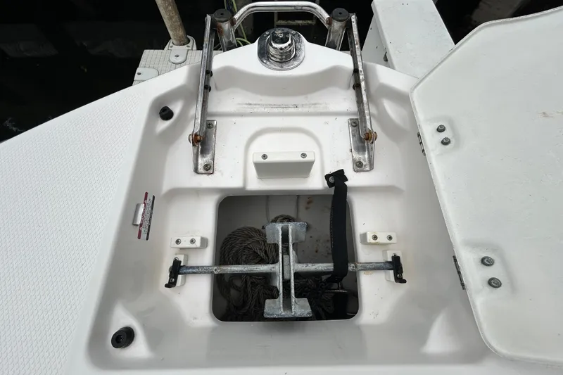 Slide: The Image of Coiled black rope in Chaparral 230 Suncoast 2020 storage compartment. - 109