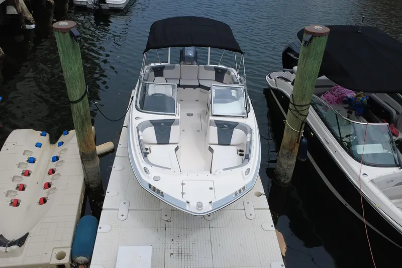 Slide: The Image of 2020 Chaparral 230 Suncoast boat docked at marina, aerial view. - 11
