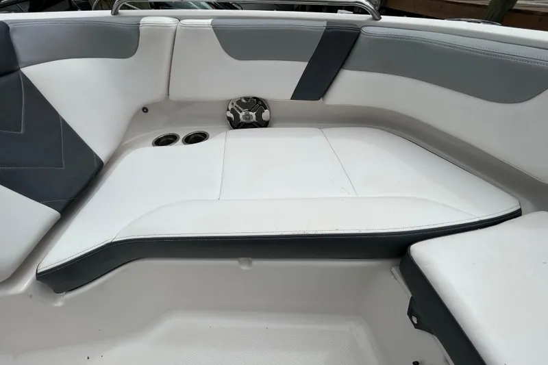 Slide: The Image of Anchor storage compartment on a 2020 Chaparral 230 Suncoast boat, featuring secure fittings. - 112