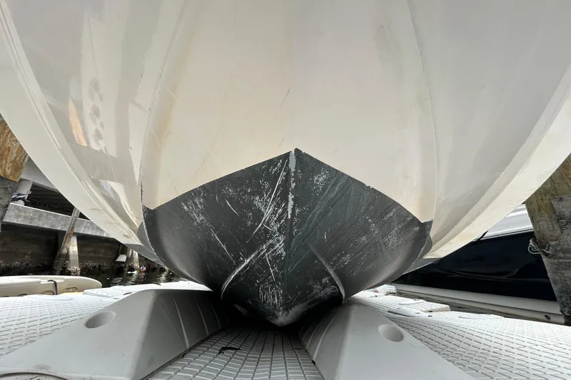 Slide: The Image of Bottom view of a 2020 Chaparral 230 Suncoast boat on a dock. - 15