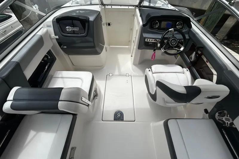 Slide: The Image of 2020 Chaparral 230 Suncoast boat interior with sleek seating and modern dashboard design. - 22