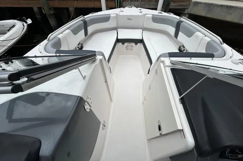 Slide: The Image of 2020 Chaparral 230 Suncoast boat interior with spacious seating and sleek design. - 32