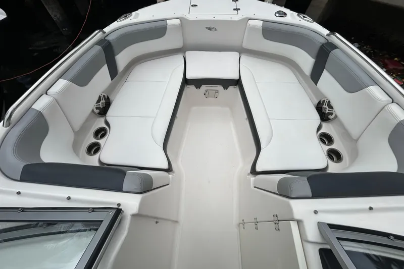 Slide: The Image of 2020 Chaparral 230 Suncoast boat interior with spacious seating and cup holders. - 33