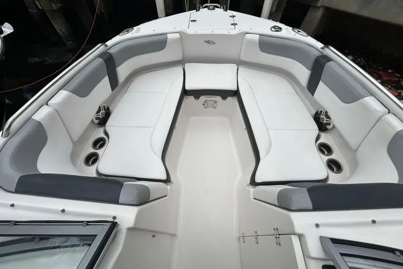 Slide: The Image of 2020 Chaparral 230 Suncoast boat interior with spacious seating and cup holders. - 34