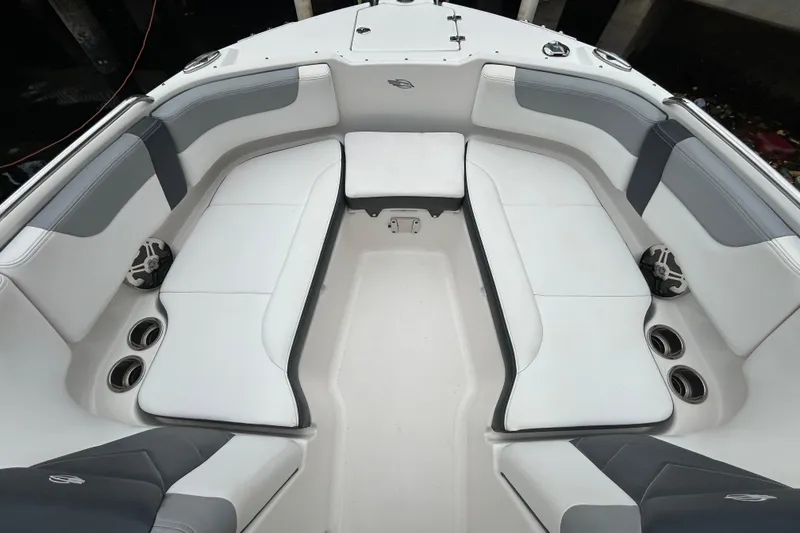 Slide: The Image of 2020 Chaparral 230 Suncoast boat interior with spacious seating and cup holders. - 35