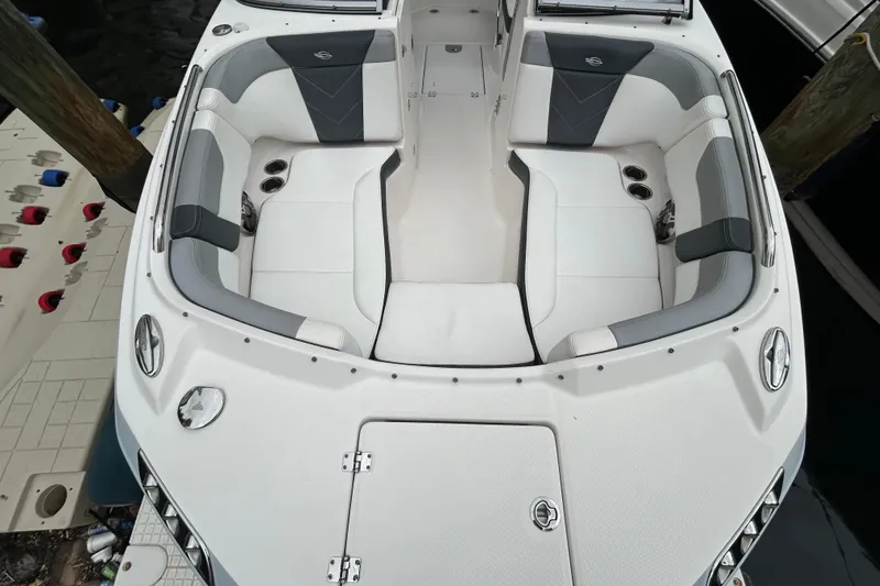 Slide: The Image of 2020 Chaparral 230 Suncoast boat interior with spacious seating and cup holders. - 37