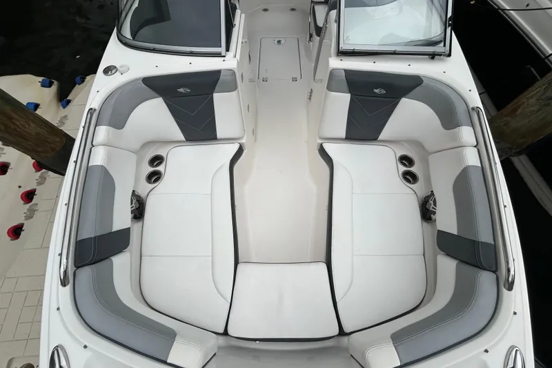 Slide: The Image of 2020 Chaparral 230 Suncoast boat interior with stylish seating and cup holders. - 39