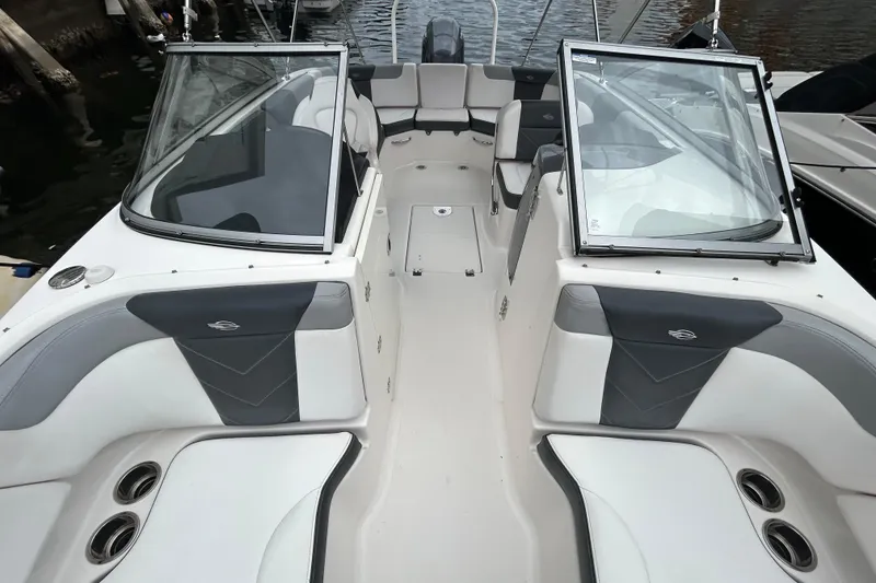 Slide: The Image of 2020 Chaparral 230 Suncoast boat interior with seating and windshield. - 43
