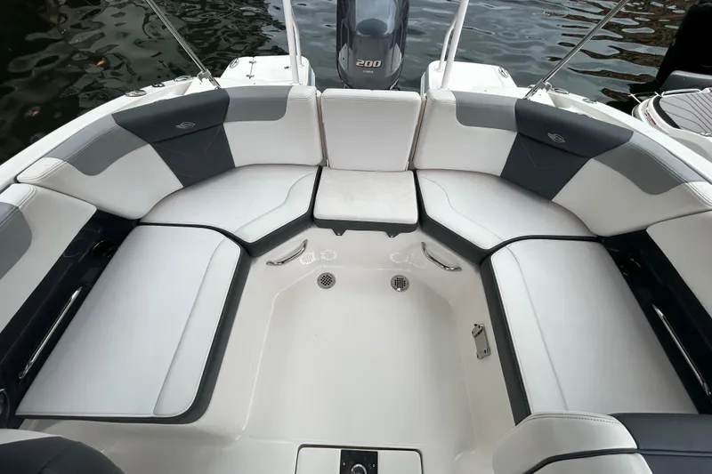 Slide: The Image of 2020 Chaparral 230 Suncoast boat interior with spacious seating and sleek design. - 48