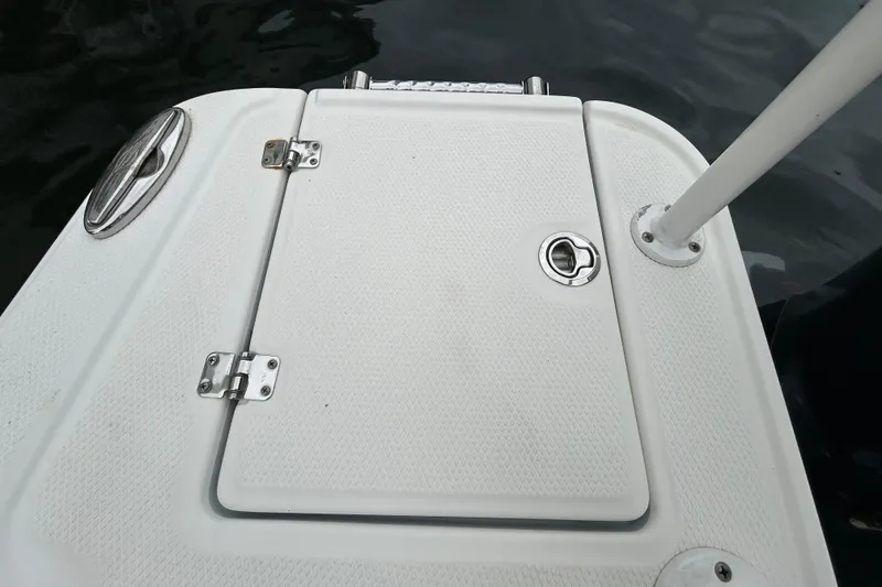 Slide: The Image of 2020 Chaparral 230 Suncoast boat deck with hatch and railing. - 53