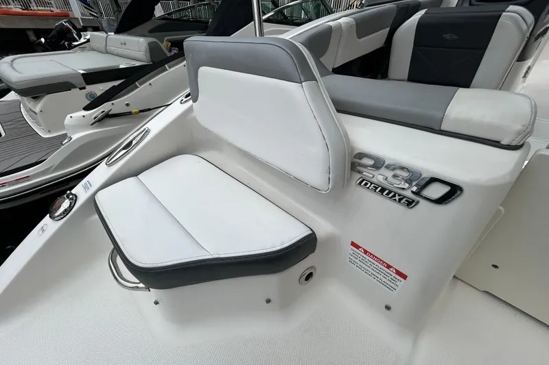 Slide: The Image of 2020 Chaparral 230 Suncoast boat interior with deluxe seating and branding details. - 57