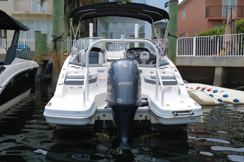 Slide: The Image of 2020 Chaparral 230 Suncoast boat with Yamaha engine at dock. - 6