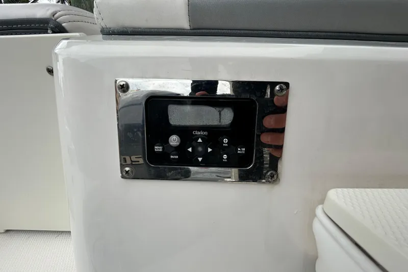 Slide: The Image of 2020 Chaparral 230 Suncoast boat stereo control panel with Clarion system. - 62
