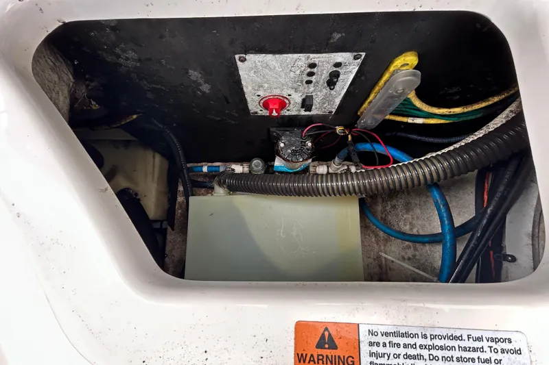Slide: The Image of Engine compartment of 2020 Chaparral 230 Suncoast boat with wiring and warning label. - 66