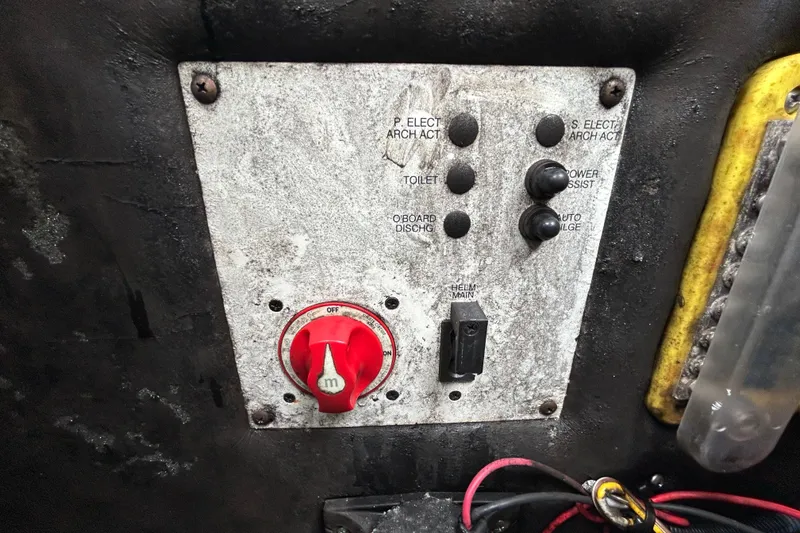 Slide: The Image of Control panel of a 2020 Chaparral 230 Suncoast boat with switches and wiring. - 67