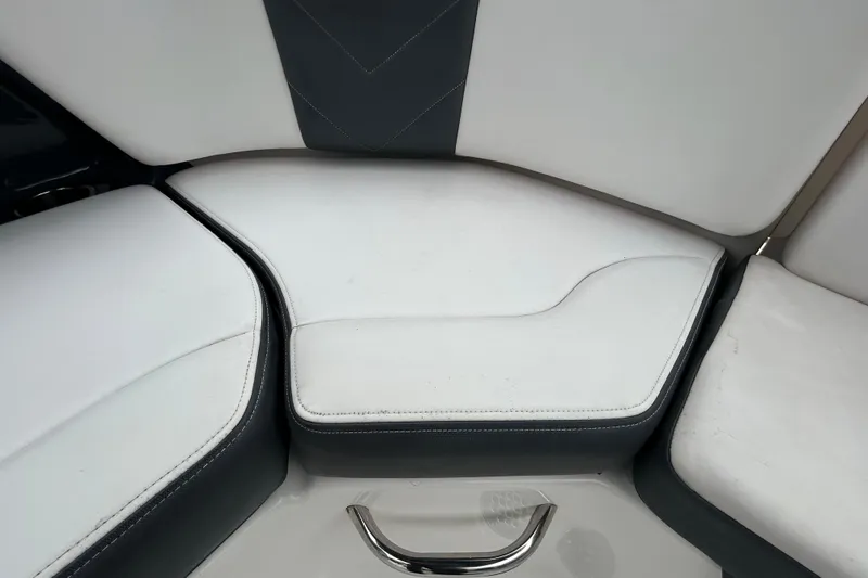 Slide: The Image of 2020 Chaparral 230 Suncoast boat interior seating with white and gray upholstery. - 71
