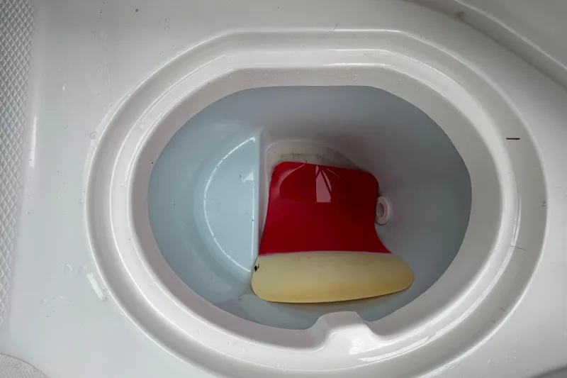 Slide: The Image of Red and yellow object in Chaparral 230 Suncoast 2020 boat compartment. - 78