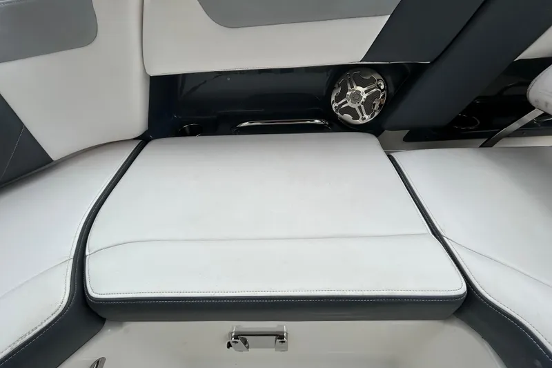 Slide: The Image of 2020 Chaparral 230 Suncoast boat interior seating with speaker detail. - 79