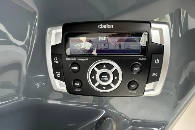 Slide: The Image of Clarion CMS2 stereo system in 2020 Chaparral 230 Suncoast boat dashboard. - 87