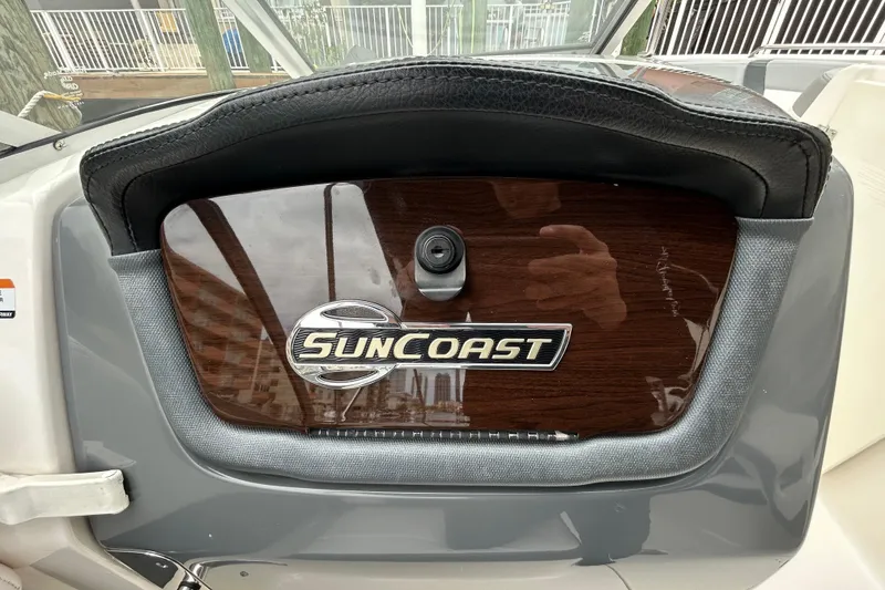 Slide: The Image of Dashboard of 2020 Chaparral 230 Suncoast boat with Suncoast logo. - 89