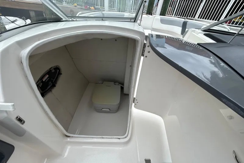 Slide: The Image of 2020 Chaparral 230 Suncoast boat interior with compact toilet compartment. - 93