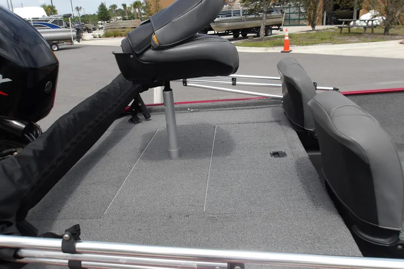 Slide: The Image of 2024 Tracker Bass Tracker Classic XL boat interior with seating and carpeted deck. - 10