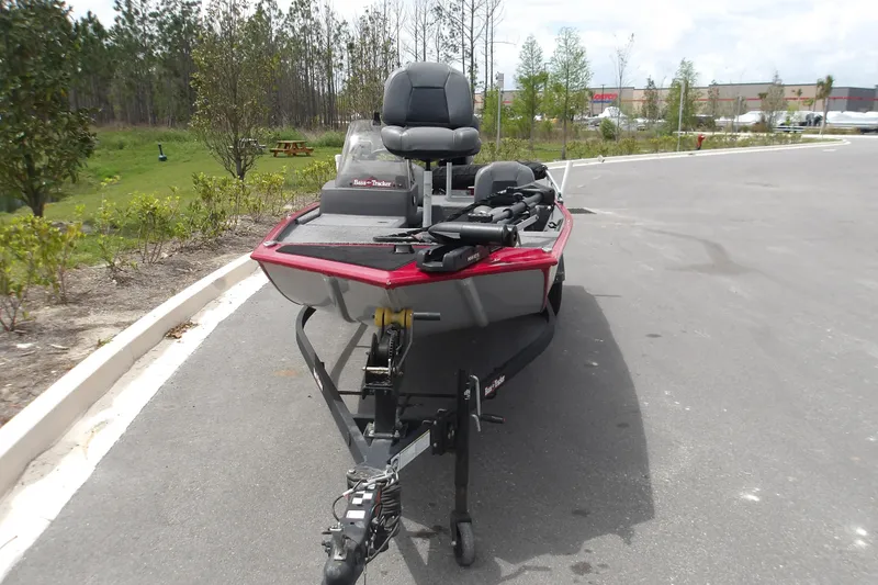 Slide: The Image of 2024 Tracker Bass Tracker Classic XL boat on trailer in parking lot. - 2