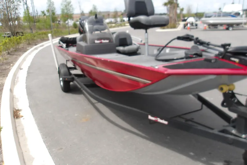 Slide: The Image of 2024 Tracker Bass Tracker Classic XL boat on trailer, parked outdoors. - 3
