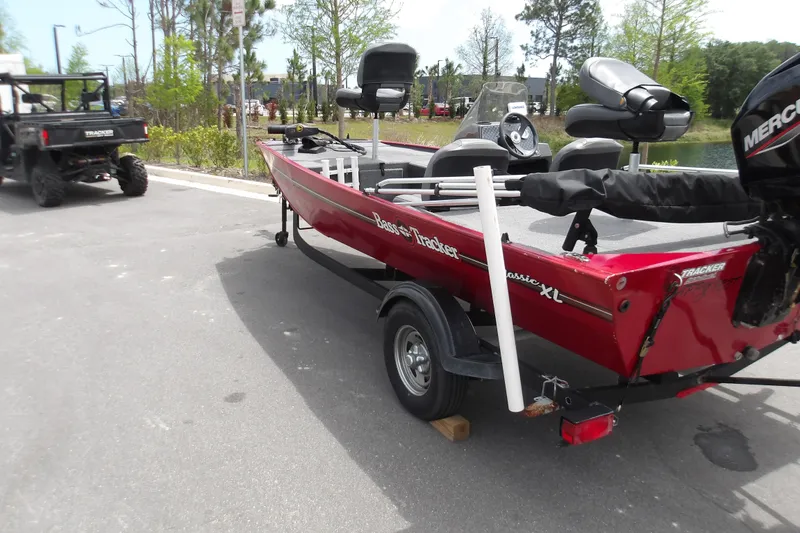 Slide: The Image of 2024 Tracker Bass Tracker Classic XL boat on trailer, parked outdoors. - 5