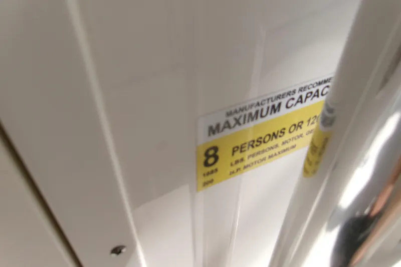 Slide: The Image of Key West 203 FS 2020 boat capacity label, maximum 8 persons or 1200 lbs. - 16