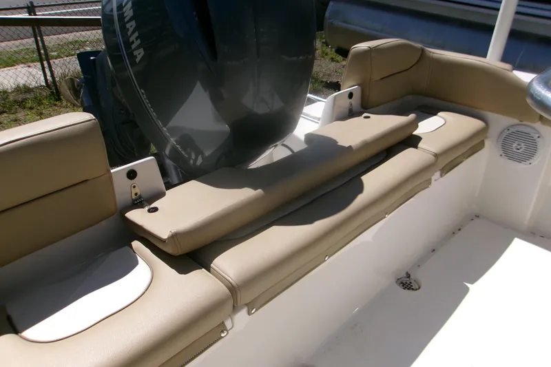 Slide: The Image of 2020 Key West 203 FS boat interior with beige seating and Yamaha engine. - 6