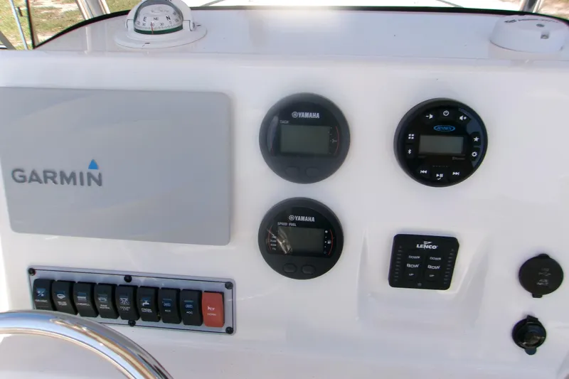 Slide: The Image of Control panel of a 2020 Key West 203 FS boat featuring Garmin and Yamaha instruments. - 8