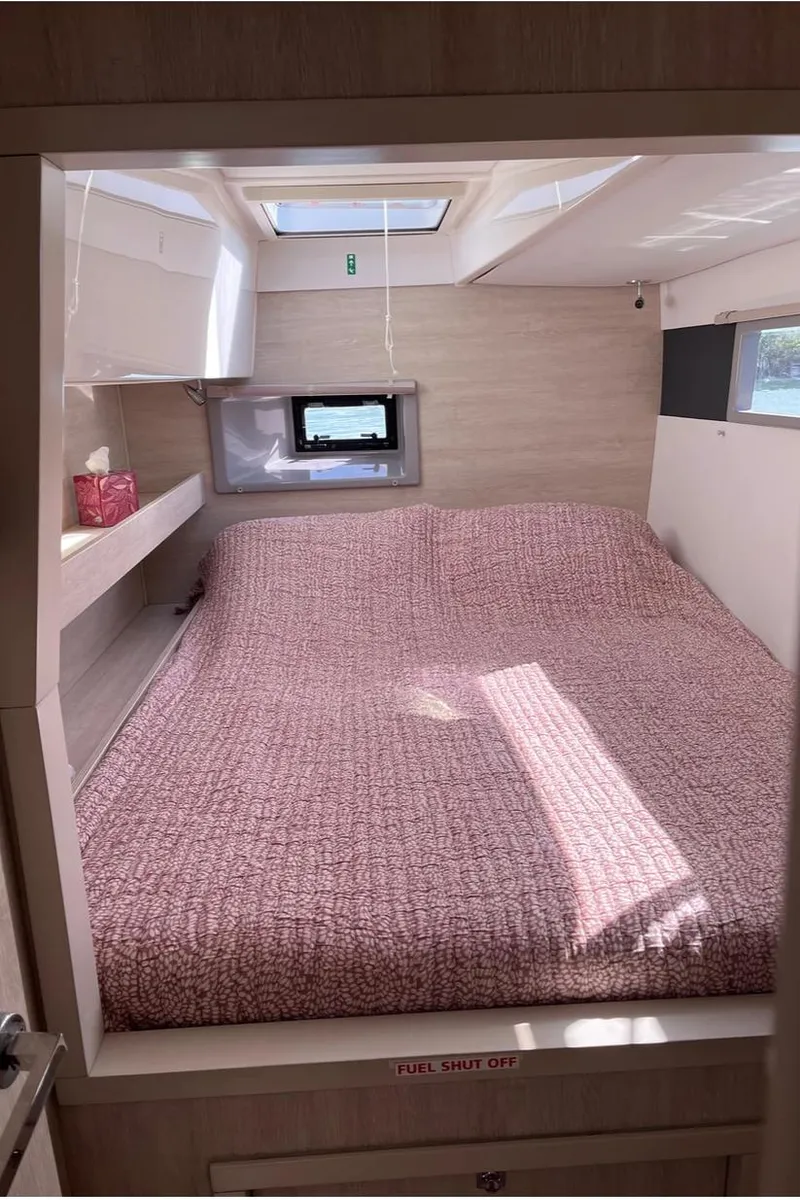 Slide: The Image of Interior of a Leopard 40 yacht, cozy bedroom with skylight. - 19
