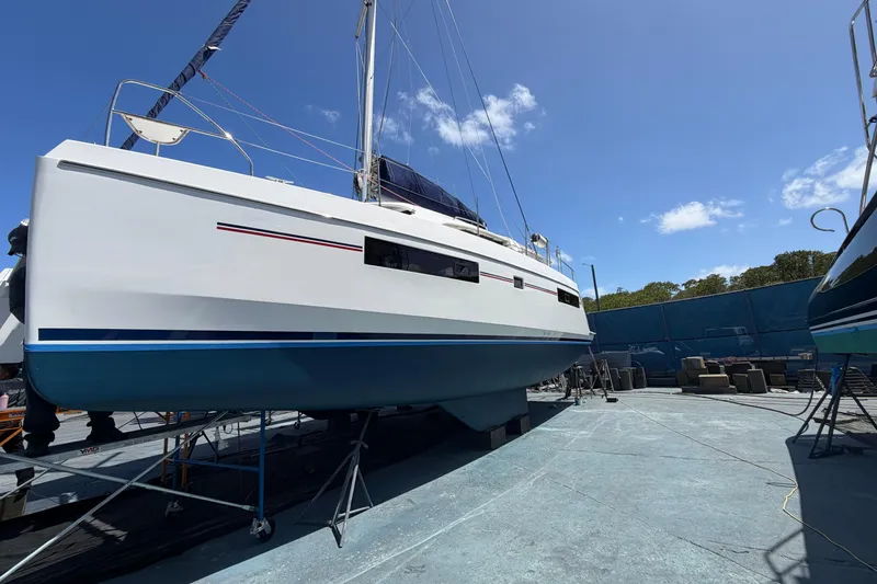 Slide: The Image of 2018 Leopard 40 catamaran on dry dock under clear blue sky. - 2