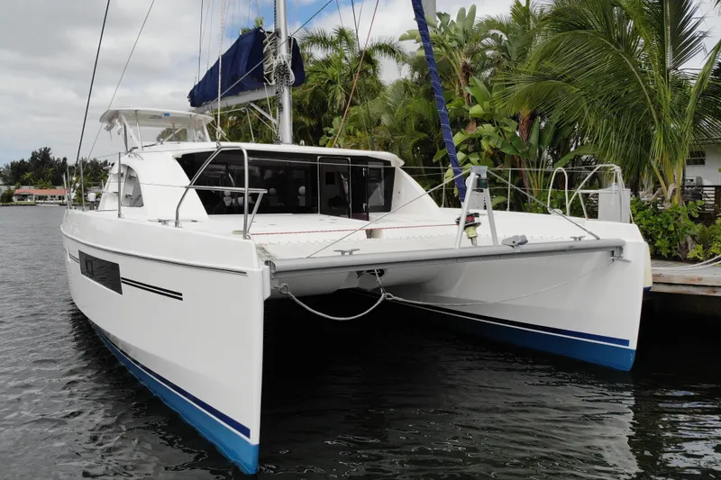 Slide: The Image of 2018 Leopard 40 catamaran docked near lush tropical foliage. - 24