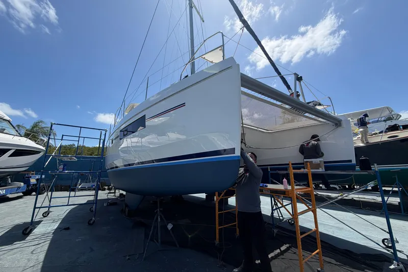 Slide: The Image of 2018 Leopard 40 catamaran undergoing maintenance in a sunny boatyard. - 27