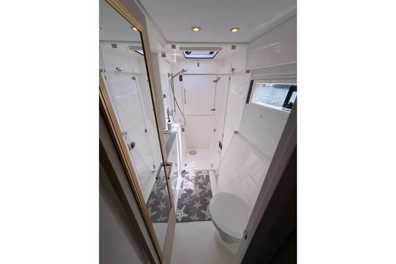 Slide: The Image of Modern bathroom interior in a 2018 Leopard 40 yacht, featuring sleek design and fixtures. - 38