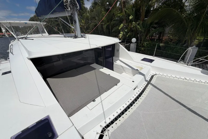 Slide: The Image of 2018 Leopard 40 catamaran deck with seating and netting, surrounded by tropical foliage. - 41