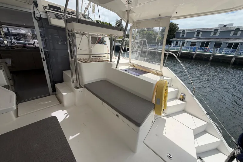 Slide: The Image of 2018 Leopard 40 catamaran cockpit with seating, dockside view, and modern design elements. - 47